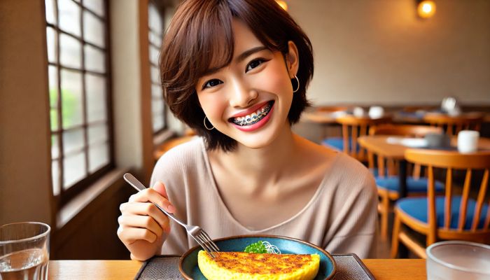 食事をする矯正治療中の女性